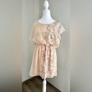 Peachy and gold sequins on this sheer overlay adorable dress for any occasion!